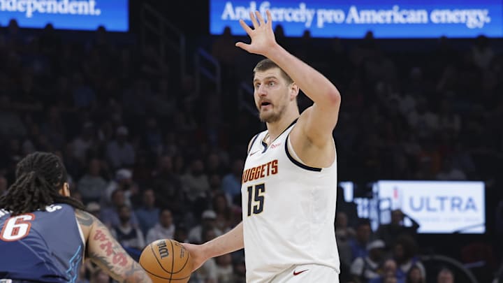 Feb 27, 2026; Oklahoma City, Oklahoma, USA; Denver Nuggets center Nikola Jokić (15) gestures to his team during a play against the Oklahoma City Thunder during the first quarter at Paycom Center. Mandatory Credit: Alonzo Adams-Imagn Images