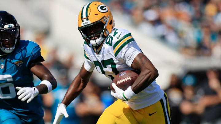 Green Bay Packers wide receiver Romeo Doubs (87) rushes for yards against Jacksonville Jaguars safety Darnell Savage (6) during the first quarter of an NFL football matchup Sunday, Oct. 27, 2024 at EverBank Stadium in Jacksonville, Fla. The Packers edged the Jaguars 30-27 on a last-second field goal. [Corey Perrine/Florida Times-Union]