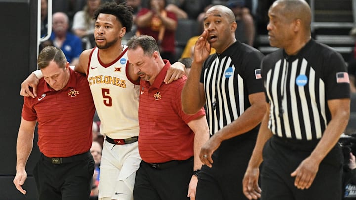 Mar 20, 2026; St. Louis, MO, USA; Iowa State Cyclones forward Joshua Jefferson (5) is helped off of the court after suffering an apparent injury to his left leg while shooting a layup against Tennessee State Tigers forward Jalen Pitre (not pictured) during the first half of a first round game of the men's 2026 NCAA Tournament at Enterprise Center. Mar 20, 2026; St. Louis, MO, USA; Iowa State Cyclones forward Joshua Jefferson (5) is helped off of the court after suffering an apparent injury to his left leg while shooting a layup against Tennessee State Tigers forward Jalen Pitre (not pictured) during the first half of a first round game of the men's 2026 NCAA Tournament at Enterprise Center.