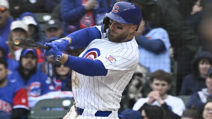 Mar 26, 2026; Chicago, Illinois, USA;  Chicago Cubs first baseman Michael Busch (29) hits a RBI single against the Washington Nationals during the third inning at Wrigley Field. Mandatory Credit: Matt Marton-Imagn Images