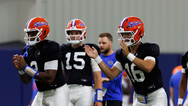 Florida Gators quarterback DJ Lagway (2) and Florida Gators quarterback Aidan Warner (16) start a drill during fall football practice at Sanders Indoor Practice Fields at the University of Florida in Gainesville, FL on Thursday, August 7, 2025. [Matt Pendleton/Gainesville Sun]