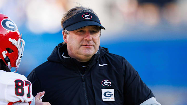 Nov 19, 2022; Lexington, Kentucky, USA; Georgia Bulldogs head coach Kirby Smart hugs wide receiver Mekhi Mews (87) before the game against the Kentucky Wildcats at Kroger Field. Mandatory Credit: Jordan Prather-Imagn Images