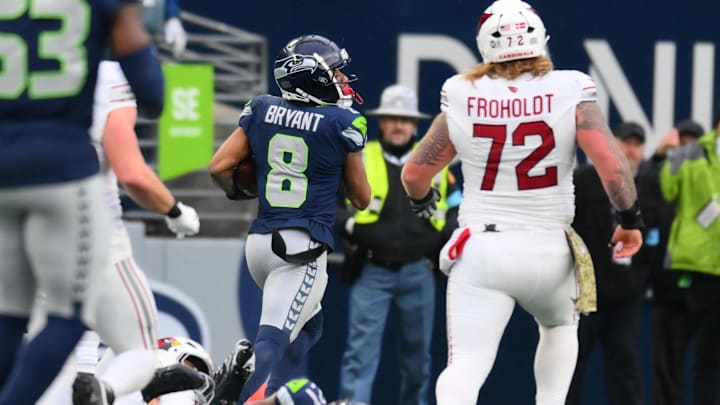 Nov 24, 2024; Seattle, Washington, USA; Seattle Seahawks cornerback Coby Bryant (8) returns an interception for a touchdown against the Arizona Cardinals during the second half at Lumen Field. Mandatory Credit: Steven Bisig-Imagn Images