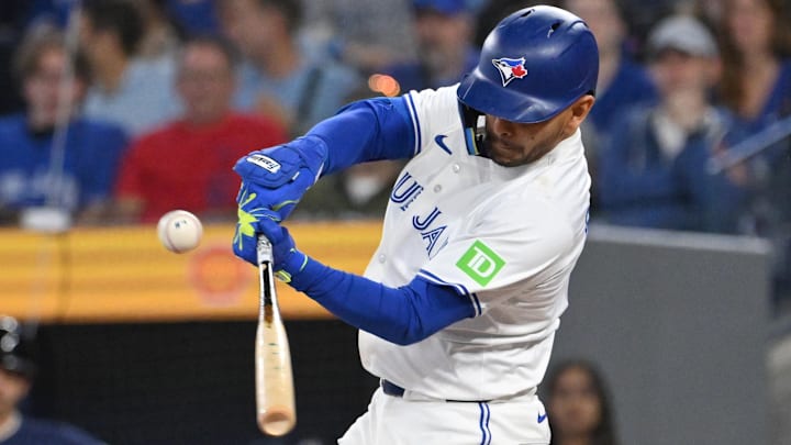 Apr 19, 2025; Toronto, Ontario, CAN;  Toronto Blue Jays second baseman Andres Gimenez (0) hits a double against the Seattle Mariners in the first inning at Rogers Centre.