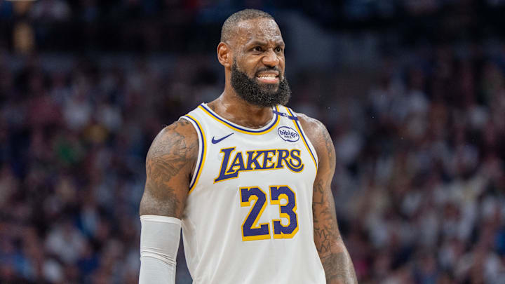 Apr 27, 2025; Minneapolis, Minnesota, USA; Los Angeles Lakers forward LeBron James (23) talks with a referee in the third quarter against the Minnesota Timberwolves during game four of first round for the 2025 NBA Playoffs at Target Center. Mandatory Credit: Matt Blewett-Imagn Images