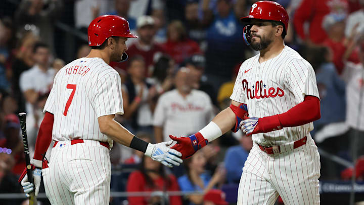 Philadelphia Phillies designated hitter Kyle Schwarber (12) shakes hands with shortstop Trea Turner (7) after hitting a solo home run during the sixth inning against the Tampa Bay Rays at Citizens Bank Park.