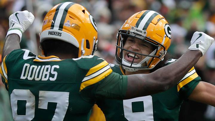 Green Bay Packers receiver Romeo Doubs (87) celebrates with Christian Watson (9) after catching a touchdown pass. Green Bay Packers receiver Romeo Doubs (87) celebrates with Christian Watson (9) after catching a touchdown pass.