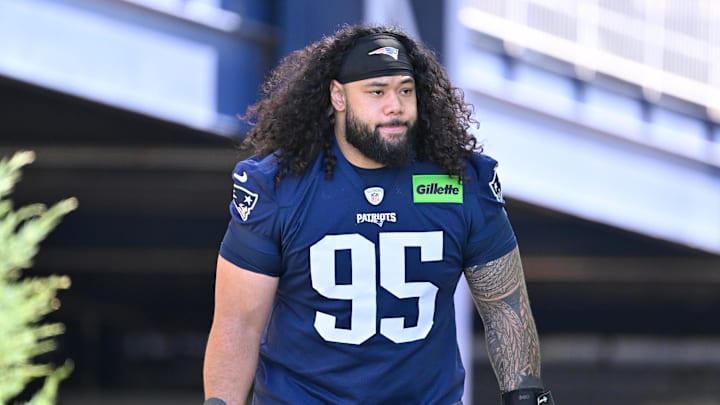 Jul 23, 2025; Foxborough, MA, USA; New England Patriots defensive tackle Khyiris Tonga (95)  walks to the practice field for training camp at Gillette Stadium. Mandatory Credit: Eric Canha-Imagn Images