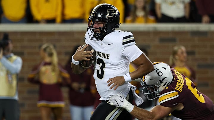 Purdue Boilermakers quarterback Malachi Singleton (3) runs the ball for a touchdown 