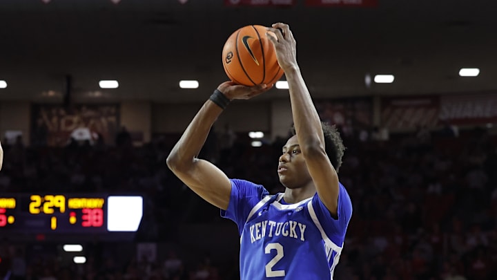 Feb 26, 2025; Norman, Oklahoma, USA; Kentucky Wildcats guard Jaxson Robinson (2) shoots a three point basket as Oklahoma Sooners guard Duke Miles (15) defend during the first half at Lloyd Noble Center. Mandatory Credit: Alonzo Adams-Imagn Images