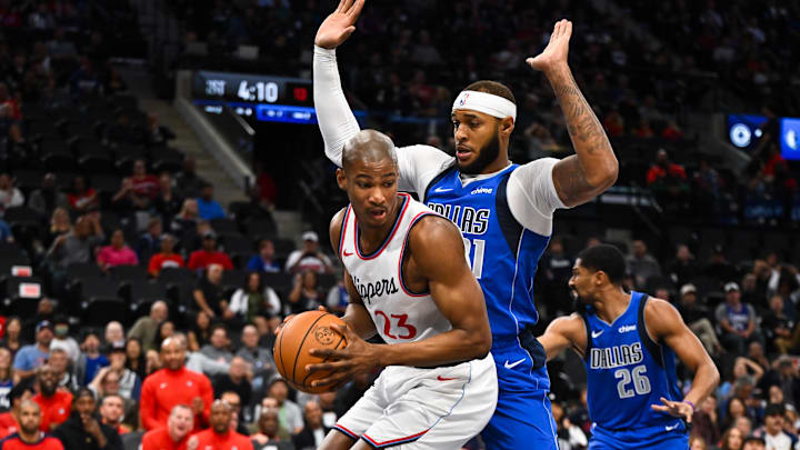Oct 14, 2024; Inglewood, California, USA; LA Clippers forward Kai Jones (23) looks to pass against Dallas Mavericks center Daniel Gafford (21) during the first half at Intuit Dome. Mandatory Credit: Jonathan Hui-Imagn Images Oct 14, 2024; Inglewood, California, USA; LA Clippers forward Kai Jones (23) looks to pass against Dallas Mavericks center Daniel Gafford (21) during the first half at Intuit Dome. Mandatory Credit: Jonathan Hui-Imagn Images