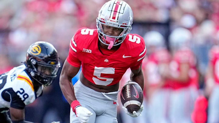 Ohio State Buckeyes wide receiver Mylan Graham (5) runs past Grambling State Tigers defensive back Christen Williams (29) during the second half of the NCAA football game at Ohio Stadium on Sept. 6, 2025. Ohio State won 70-0.