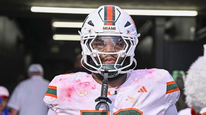 Nov 1, 2025; Dallas, Texas, USA;  Miami Hurricanes offensive lineman Anez Cooper (73) looks on from the tunnel as the SMU Mustangs celebrate the victory over the Hurricanes during the overtime period  at Gerald J. Ford Stadium. Mandatory Credit: Jerome Miron-Imagn Images