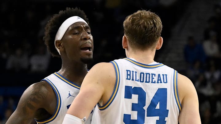Mar 3, 2026; Los Angeles, California, USA; UCLA Bruins forward Tyler Bilodeau (34) chest dumps teammate Eric Dailey Jr. (3) after hitting a 3-point shot during the second} half at Pauley Pavilion presented by Wescom Financial. Mandatory Credit: Robert Hanashiro-Imagn Images