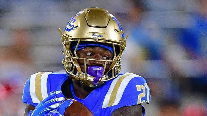 Aug 30, 2025; Pasadena, California, USA; UCLA Bruins defensive back Cole Martin (21) is brought down by Utah Utes cornerback Jason Stokes Jr. (13) during the second half at Rose Bowl. Mandatory Credit: Gary A. Vasquez-Imagn Images Aug 30, 2025; Pasadena, California, USA; UCLA Bruins defensive back Cole Martin (21) is brought down by Utah Utes cornerback Jason Stokes Jr. (13) during the second half at Rose Bowl. Mandatory Credit: Gary A. Vasquez-Imagn Images