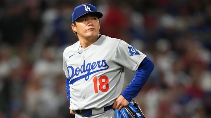Aug 11, 2025; Anaheim, California, USA; Los Angeles Dodgers starting pitcher Yoshinobu Yamamoto (18) reacts after being removed in the fifth inning against the Los Angeles Angels at Angel Stadium. Mandatory Credit: Kirby Lee-Imagn Images
