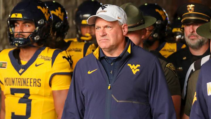 Sep 26, 2026; Morgantown, West Virginia, USA; West Virginia Mountaineers head coach Rich Rodriguez leads his team onto the field prior to their game against the Oklahoma State Cowboys at Milan Puskar Stadium. Mandatory Credit: Ben Queen-Imagn Images