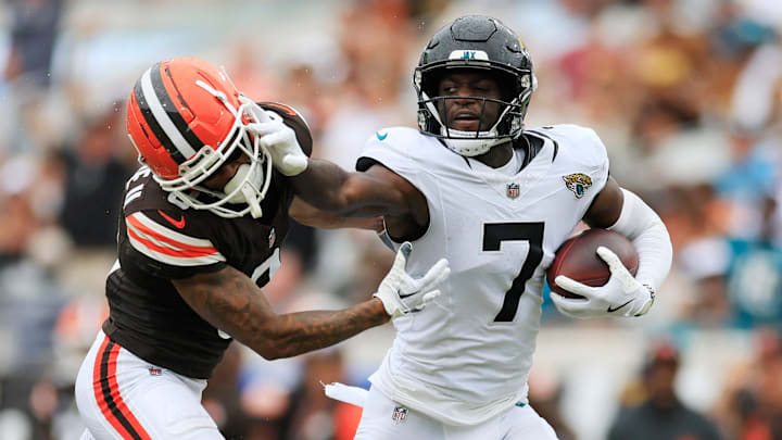 Jacksonville Jaguars wide receiver Brian Thomas Jr. (7) stiff arms Cleveland Browns cornerback Greg Newsome II (0) during the third quarter of an NFL football matchup Sunday, Sept. 15, 2024 at EverBank Stadium in Jacksonville, Fla. The Browns defeated the Jaguars 18-13. [Corey Perrine/Florida Times-Union]