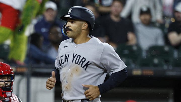 Aug 29, 2025; Chicago, Illinois, USA; New York Yankees center fielder Trent Grisham (12) crosses home plate after hitting a grand slam against the Chicago White Sox during the fourth inning at Rate Field. Mandatory Credit: Kamil Krzaczynski-Imagn Images
