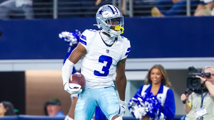 Nov 23, 2025; Arlington, Texas, USA; Dallas Cowboys wide receiver George Pickens (3) reacts after making a catch over Philadelphia Eagles cornerback Cooper DeJean (33) and Philadelphia Eagles safety Sydney Brown (21) during the game at AT&T Stadium. Mandatory Credit: Kevin Jairaj-Imagn Images
