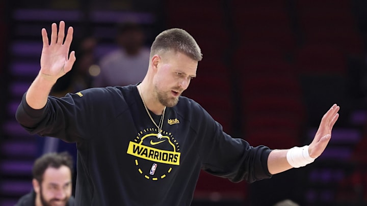 Mar 5, 2026; Houston, Texas, USA; Golden State Warriors center Kristaps Porzingis (7) reacts while warming up before the game against the Houston Rockets at Toyota Center. Mandatory Credit: Troy Taormina-Imagn Images