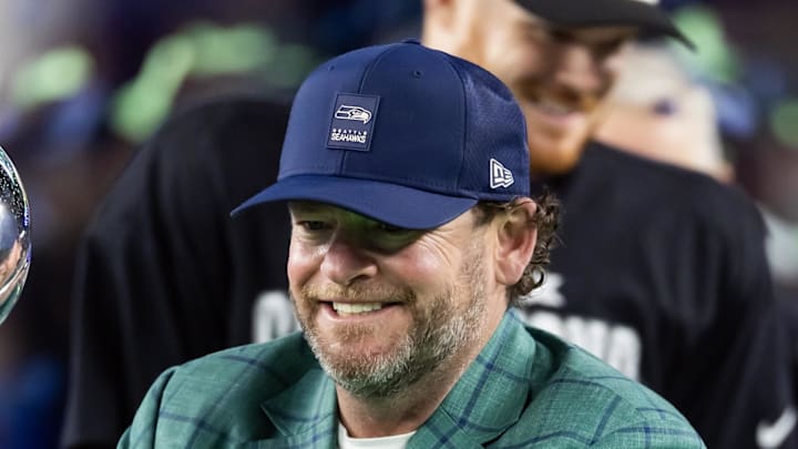 Seattle Seahawks general manager John Schneider celebrates with the Vince Lombardi trophy.