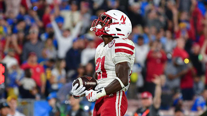 Nov 8, 2025; Pasadena, California, USA; Nebraska Cornhuskers running back Emmett Johnson (21) celebrates his touchdown scored against the UCLA Bruins during the first half at the Rose Bowl. Mandatory Credit: Gary A. Vasquez-Imagn Images