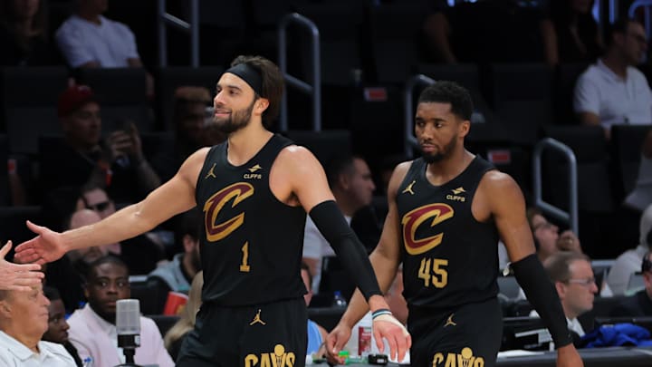 Apr 26, 2025; Miami, Florida, USA; Cleveland Cavaliers guard Max Strus (1) high-fives with head coach Kenny Atkinson in the fourth quarter against the Miami Heat during game three for the first round of the 2025 NBA Playoffs at Kaseya Center. Mandatory Credit: Sam Navarro-Imagn Images Apr 26, 2025; Miami, Florida, USA; Cleveland Cavaliers guard Max Strus (1) high-fives with head coach Kenny Atkinson in the fourth quarter against the Miami Heat during game three for the first round of the 2025 NBA Playoffs at Kaseya Center. Mandatory Credit: Sam Navarro-Imagn Images