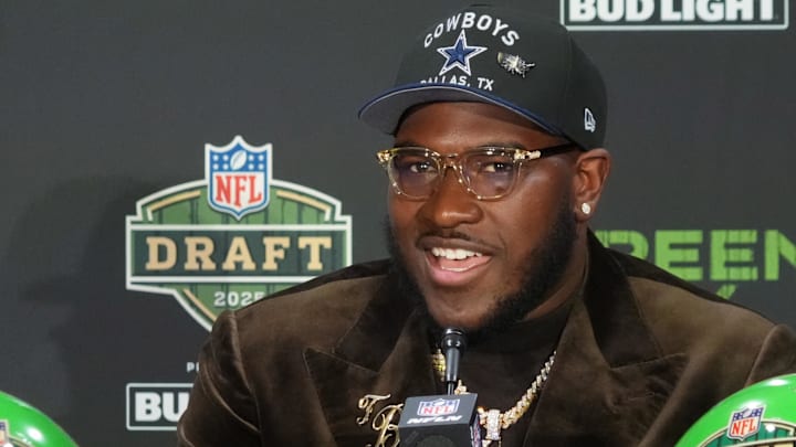 Tyler Booker speaks in a press conference after being selected by the Dallas Cowboys as the number 12 pick in the first round of the 2025 NFL Draft at Lambeau Field. Mandatory Credit: Kirby Lee-Imagn Images