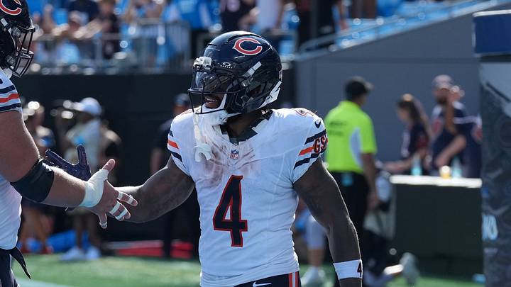 Sep 13, 2026; Charlotte, North Carolina, USA;  Chicago Bears center Garrett Bradbury (67) congratulates running back D'Andre Swift (4) after scoring a touchdown in the fourth quarter against the Carolina Panthers at Bank of America Stadium.  Mandatory Credit: Jim Dedmon-Imagn Images
