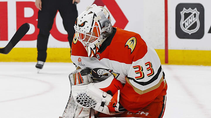 Jan 26, 2026; Edmonton, Alberta, CAN; Edmonton Oilers forward Kasperi Kapanen (42) looks for a loose puck in front of Anaheim Ducks goaltender Ville Husso (33) during the first period at Rogers Place. Mandatory Credit: Perry Nelson-Imagn Images