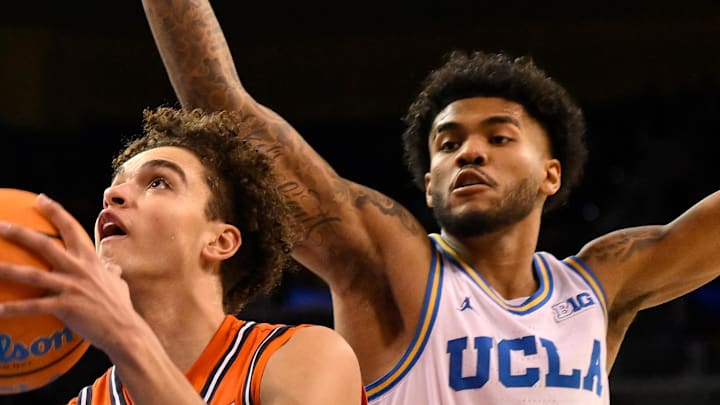 Feb 21, 2026; Los Angeles, California, USA; Illinois guard Keaton Wagler (23) drives to the basket past UCLA guard Donovan Dent (2) during the second half at Pauley Pavilion presented by Wescom Financial. Mandatory Credit: Robert Hanashiro-Imagn Images Feb 21, 2026; Los Angeles, California, USA; Illinois guard Keaton Wagler (23) drives to the basket past UCLA guard Donovan Dent (2) during the second half at Pauley Pavilion presented by Wescom Financial. Mandatory Credit: Robert Hanashiro-Imagn Images