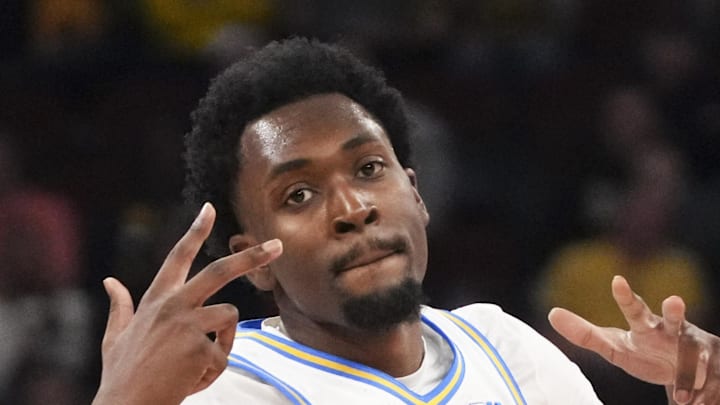 Mar 14, 2026; Chicago, IL, USA; UCLA Bruins center Xavier Booker (1) reacts after making a three point basket against the Purdue Boilermakers during the first half at United Center. Mandatory Credit: David Banks-Imagn Images