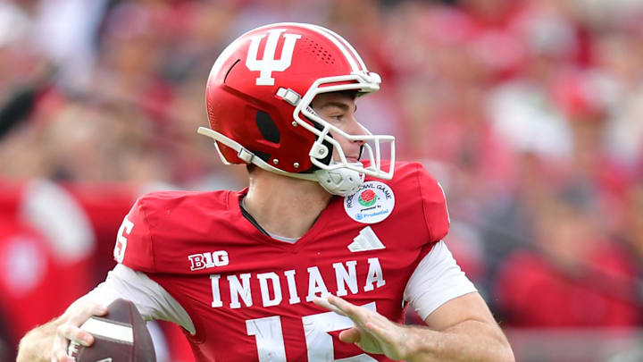 Jan 1, 2026; Pasadena, CA, USA; Indiana Hoosiers quarterback Fernando Mendoza (15) throws a pass for a touchdown against the Alabama Crimson Tide in the first half of the 2026 Rose Bowl and quarterfinal game of the College Football Playoff at Rose Bowl Stadium. Mandatory Credit: Gary A. Vasquez-Imagn Images