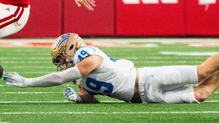 Nov 2, 2024; Lincoln, Nebraska, USA; Nebraska Cornhuskers quarterback Heinrich Haarberg (10) runs out of bounds against UCLA Bruins linebacker Carson Schwesinger (49) during the fourth quarter at Memorial Stadium. Mandatory Credit: Dylan Widger-Imagn Images Nov 2, 2024; Lincoln, Nebraska, USA; Nebraska Cornhuskers quarterback Heinrich Haarberg (10) runs out of bounds against UCLA Bruins linebacker Carson Schwesinger (49) during the fourth quarter at Memorial Stadium. Mandatory Credit: Dylan Widger-Imagn Images