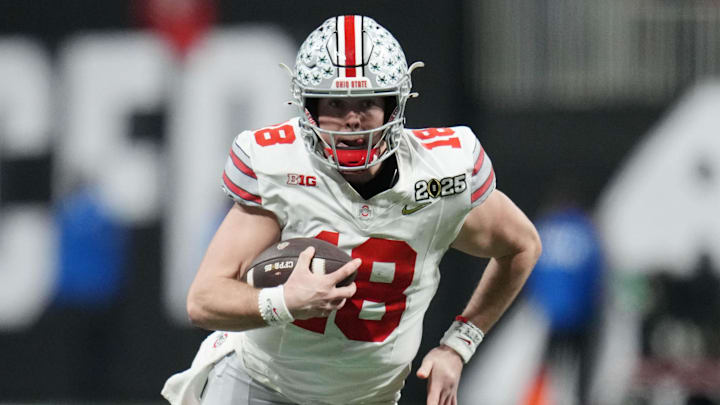 Jan 20, 2025; Atlanta, GA, USA; Ohio State Buckeyes quarterback Will Howard (18) runs the ball against the Notre Dame Fighting Irish in the second half in the CFP National Championship college football game at Mercedes-Benz Stadium. Mandatory Credit: Kirby Lee-Imagn Images