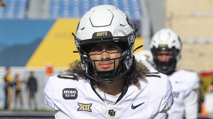 Nov 8, 2025; Morgantown, West Virginia, USA; Colorado Buffaloes quarterback Julian Lewis (10) warms up prior to their game against the West Virginia Mountaineers at Milan Puskar Stadium. Mandatory Credit: Ben Queen-Imagn Images