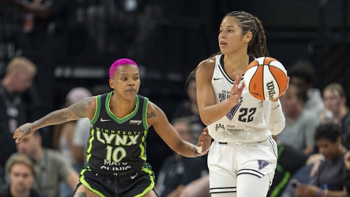 Golden State Valkyries guard Veronica Burton (22) dribbles the ball and looks to pass as Minnesota Lynx guard Courtney Williams (10) plays defense in the first half during game one of round one for the 2025 WNBA Playoffs at Target Center. 