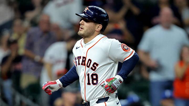 Houston Astros center fielder Dalton Varsho (18) crosses home plate