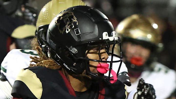 Running back Deshonne Redeaux finds an opening during the first quarter of Oaks Christian's 35-0 Marmonte League win over St. Bonaventure Friday night at Redell Field.