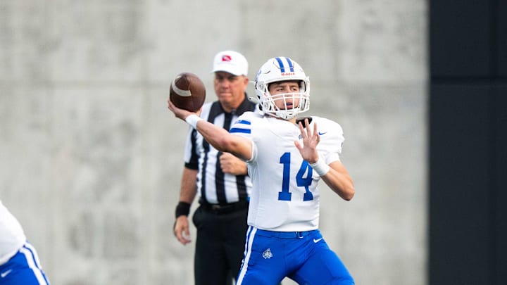 Waukee Northwest's Mack Heitland (14) throw the ball to an open receiver during a game against Roosevelt on Thursday, Sept. 12, 2024, at Mediacom Stadium in Des Moines.