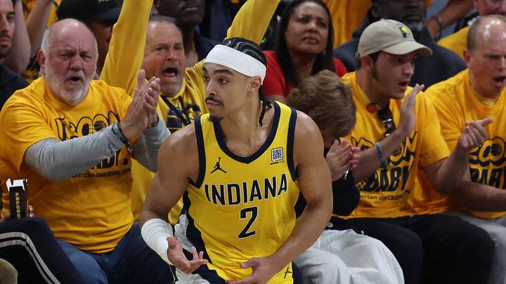 May 25, 2025; Indianapolis, Indiana, USA; Indiana Pacers guard Andrew Nembhard (2) reacts after shooting a three point basket during the first quarter of game three of the eastern conference finals for the 2025 NBA Playoffs at Gainbridge Fieldhouse. Mandatory Credit: Trevor Ruszkowski-Imagn Images