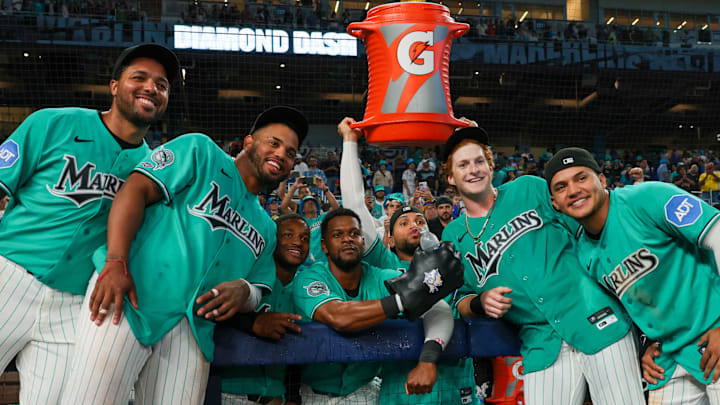 Miami Marlins right fielder Owen Caissie (17) poses for a photo with pitcher Michael Petersen (49), first baseman Deyvison de Los Santos (63), second baseman Xavier Edwards (9), shortstop Otto Lopez (6), catcher Agustin Ramirez (50), and third baseman Javier Sanoja (8). 
