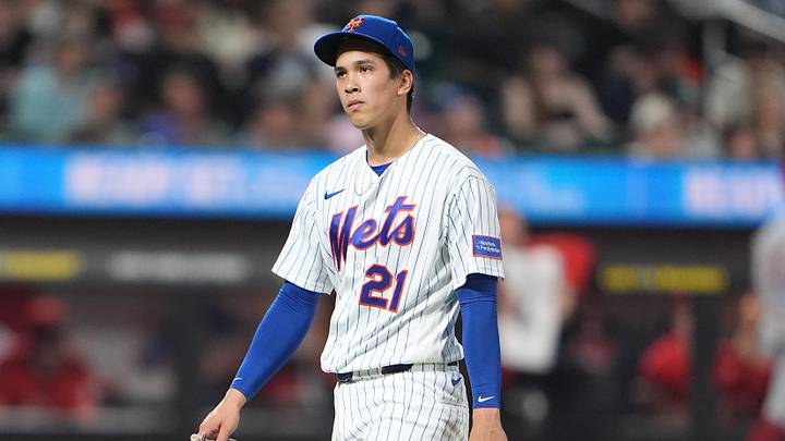 New York Mets pitcher Jonah Tong (21) walks to the dugout after being taken out of the game against the Cincinnati Reds during the fifth inning at Citi Field. New York Mets pitcher Jonah Tong (21) walks to the dugout after being taken out of the game against the Cincinnati Reds during the fifth inning at Citi Field.