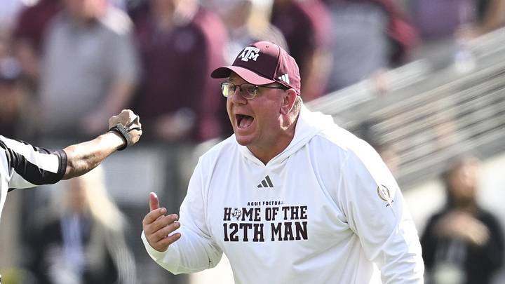 Dec 20, 2025; College Station, TX, USA; Texas A&M Aggies head coach Mike Elko reacts during the second half of the first round game of the CFP National Playoff against the Miami Hurricanes at Kyle Field. Mandatory Credit: Maria Lysaker-Imagn Images
