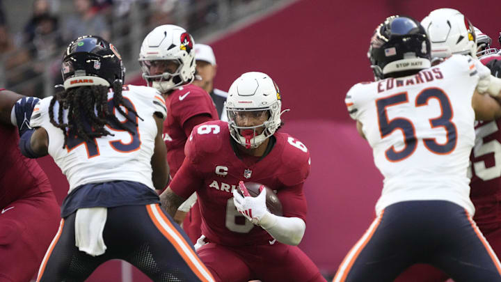 Arizona Cardinals running back James Conner (6) looks for a hole against Chicago Bears linebacker Tremaine Edmunds (49) during the first quarter at State Farm Stadium on Nov 3, 2024, in Glendale. Arizona Cardinals running back James Conner (6) looks for a hole against Chicago Bears linebacker Tremaine Edmunds (49) during the first quarter at State Farm Stadium on Nov 3, 2024, in Glendale.