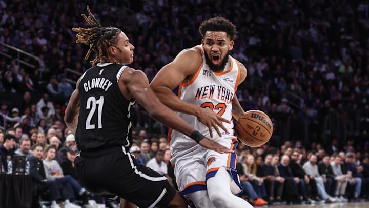 Nov 17, 2024; New York, New York, USA;  New York Knicks center Karl-Anthony Towns (32) collides with Brooklyn Nets forward Noah Clowney (21) in the third quarter at Madison Square Garden. Mandatory Credit: Wendell Cruz-Imagn Images