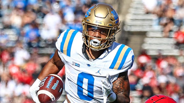 Oct 19, 2024; Piscataway, New Jersey, USA; UCLA Bruins running back Jalen Berger (0) catches a pass for a touchdown as Rutgers Scarlet Knights linebacker Abram Wright (11) pursues during the second half at SHI Stadium. Mandatory Credit: Vincent Carchietta-Imagn Images Oct 19, 2024; Piscataway, New Jersey, USA; UCLA Bruins running back Jalen Berger (0) catches a pass for a touchdown as Rutgers Scarlet Knights linebacker Abram Wright (11) pursues during the second half at SHI Stadium. Mandatory Credit: Vincent Carchietta-Imagn Images