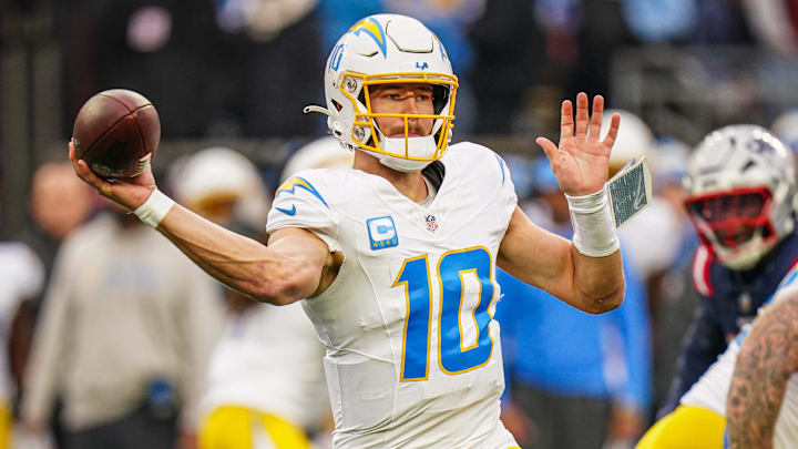 Dec 28, 2024; Foxborough, Massachusetts, USA; Los Angeles Chargers quarterback Justin Herbert (10) passes the ball against the New England Patriots in the third quarter at Gillette Stadium. Mandatory Credit: David Butler II-Imagn Images