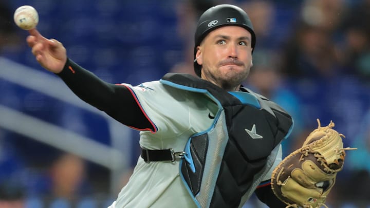 Miami Marlins catcher Nick Fortes (4) throws to first base to retire San Diego Padres third baseman Manny Machado (not pictured) during the ninth inning at loanDepot Park in Miami on July 23, 2025. 